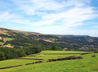 Obraz premium view of the calder valley in calderdale west yorkshire with the village of mytholmroyd visible in the distance