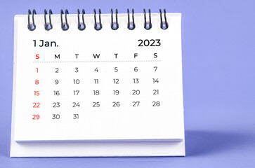 The January 2023 Monthly desk calendar for 2023 year on purple background.