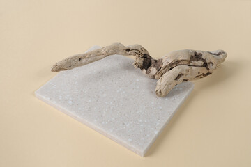 Stone product display podium with dry branch