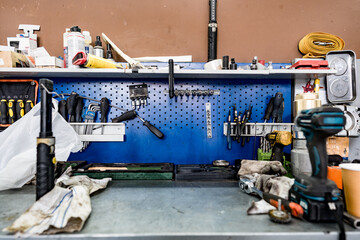 Large workbench with tools at station for vehicle technical servicing