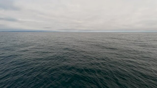 Into the Deep Blue Waters of Lake Superior. Slow motion views of the vast expanse of Lake Superior. Point of view of a boat gliding through the waves of the deep water. Located in the Upper Peninsula.