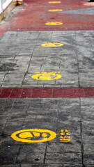 COVID-19 social distancing markers painted on a sidewalk in Cotacachi, Ecuador, when COVID-19 restrictions were in place