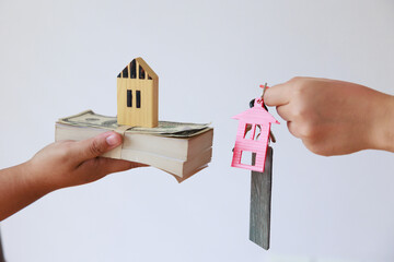 Key and house icon present exchange or contract to rent house or real estate or loan to buy a house.
