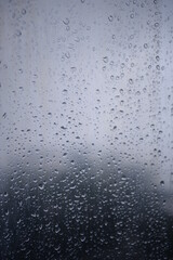 background of a light gray iron shiny sheet of iron, after the rain with dew drops, after the rain, the texture of water drops on a steel sheet with a shadow