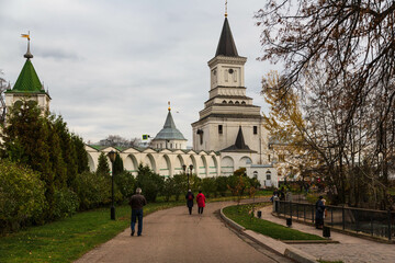 Fototapeta na wymiar DZERZHINSK, RUSSIA - October 2019: Nikolo-Ugreshsky monastery, Gate church and stone wall in autumn, Moscow region, Russia