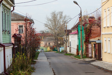 Old wooden houses in the street of Kolomna town, Moscow region, Russia
