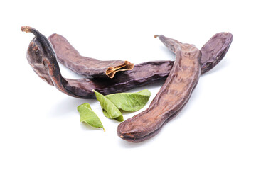 closeup of carob isolated on a white background