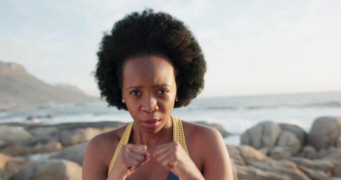 Fitness, black woman boxing and beach with exercise, training and workout by ocean or sea. Sport, health and wellness female athlete with mindset, motivation and shadow boxing for sports event