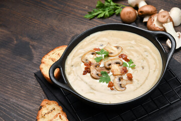Mushroom soup with bread and fresh mushrooms, autumn seasonal cream soup with vegetables
