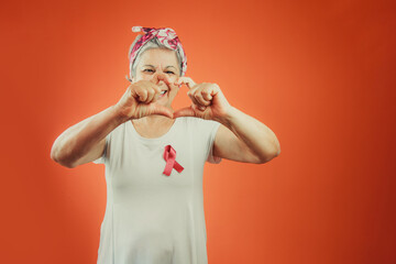 Breast Cancer Protection Symbol - Mature Woman With Pink Ribbon on and White t shirt isolated, for...