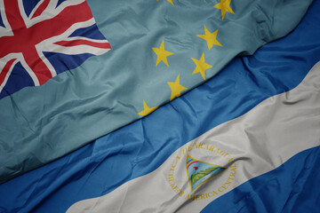 waving colorful flag of Tuvalu and national flag of nicaragua. 3d illustration