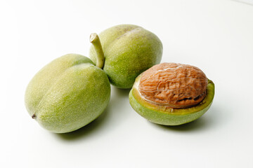 Set of Ripe Green Walnuts Isolated on White Background, walnuts on a white background.