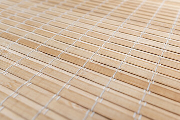 Bamboo wooden tablecloth for decor in the kitchen. The pattern is clearly visible.