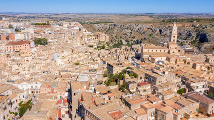 Fototapeta premium Aerial view of Cathedral of Madonna della Bruna and Sant'Eustachio located in Matera, Basilicata, Italy. It's the main Catholic place in the city. The church was built in the Apulian Romanesque style
