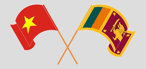 Crossed and waving flags of Vietnam and Sri Lanka