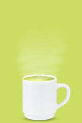 Matcha latte with steam in a cup on a green background.
