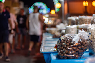 bag of hazelnuts on a street stall during a folk festival in italy