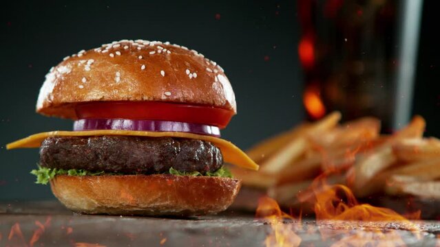 Super slow motion of stacking hamburger pieces with fire. Filmed on high speed cinema camera, 1000 fps. Speed ramp effect.