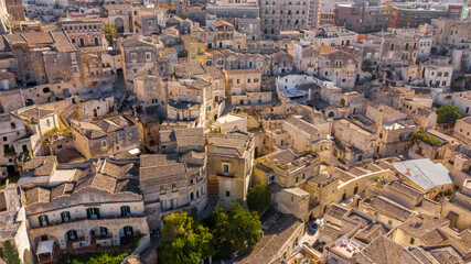 Fototapeta na wymiar Aerial view on the Sassi di Matera, located in Basilicata, Italy. They represent the historic center of the city and are a World Heritage Site. They are rupestrian architectures carved into the rock.