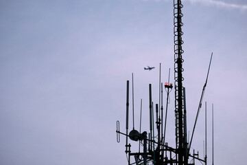 Telecommunication antenna against the evening sky