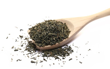 Green tea pile in wooden spoon isolated on white 