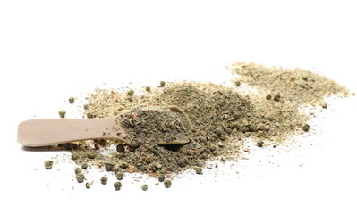 Mix seasoning, sea ​​salt, basil, other spices and lemon peel ( ​​salt, basil, cane sugar, garlic, lemon peel, green peppercorns, ground black pepper, ground chilies) in wooden spoon isolated on white