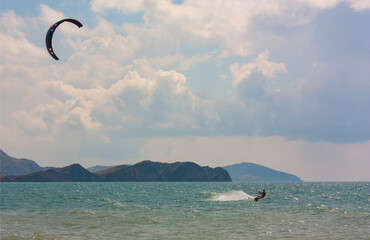 riding the kite in the sea on the waves