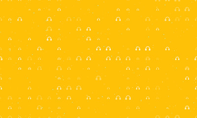 Seamless background pattern of evenly spaced white headphones symbols of different sizes and opacity. Vector illustration on amber background with stars