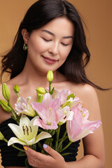 Asian female with bouquet of lilies