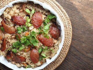top view fried rice with roasted Chinese dried sausage with dried shrimp and peanut, topped with fresh coriander leaves