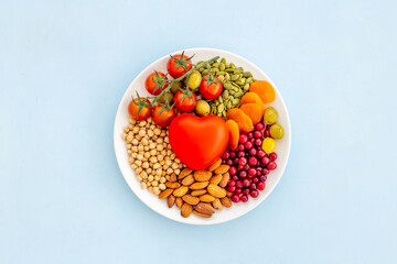 Healthy diet eating concept. Less fat more omega 3 food in plate with heart object