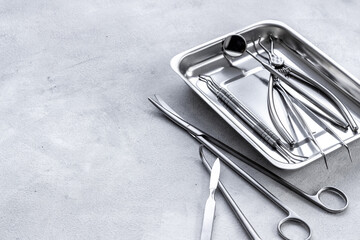 Stack of surgical medical steel equipment at surgery desk