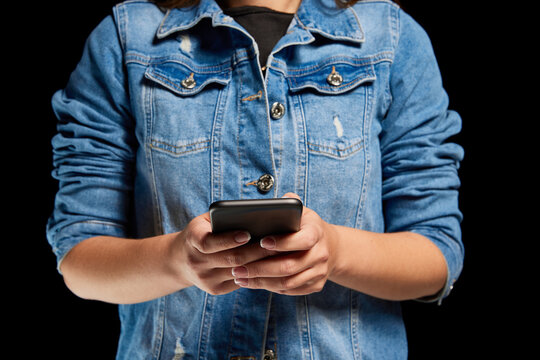 Cropped image of woman scrolling phone screen, using gadget for online donation. Concept of modern technologies, networking, help, support, charity