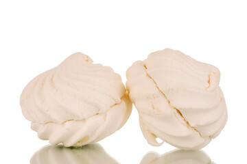 Two sweet white marshmallows, macro, isolated on white background.