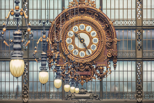 Huge clock in an ancient train station in Paris city