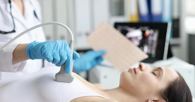 Doctor cardiologist woman patient work on ultrasound equipment in hospital