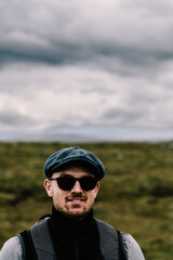 Hiker with sunglasses and baret in the Scottish Highlands. . High quality photo