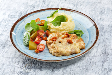 pork with mashed potato and vegetables