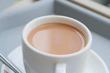 close up of cup of milk tea on table 