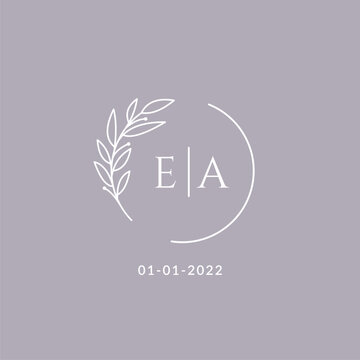 Initial monogram EA wedding logo with decorative floral frame
