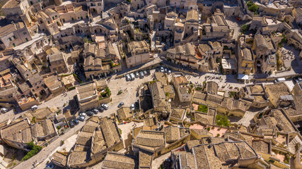 Fototapeta premium Aerial view on the Sassi di Matera, located in Basilicata, Italy. They represent the historic center of the city and are a World Heritage Site. They are rupestrian architectures carved into the rock.