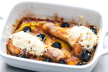chicken legs baked with black olives and cheese