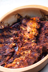 still life of baked ribs in baking plate