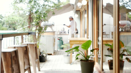 Fototapeta na wymiar Blur background of a balcony withsmall kitchen in garden.