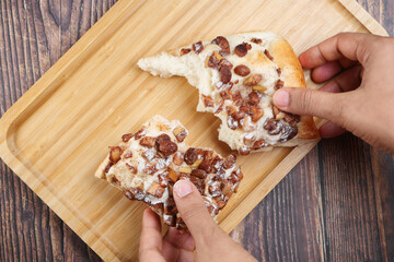  apple raisin bread on chopping board on table 