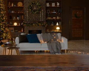 Christmas background. Empty wooden table on the background of a blurred christmas living room with beautiful golden bokeh.Ready for product montage.Banner.Copy space.Mockup.