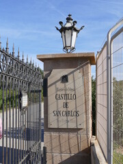 Column at the entrance to Sant Carles Military Museum in Palma de Mallorca, Mallorca, Spain (Text: "Ministry of Defence, castle san carlos, historic military museum")