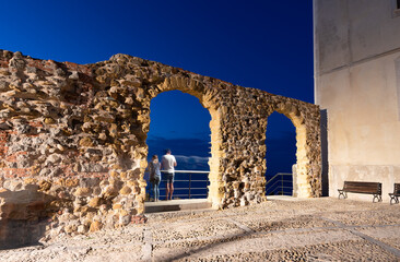 Largo Eroi Del Mare memorial wall illumintated in evening lights, on Sicily Island, Cefalu town