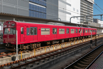 Fototapeta na wymiar Red train at a station.