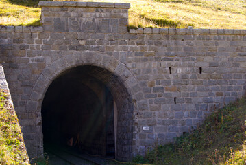 Portal of railway tunnel built 1925 at railway station Muttbach-Bélvedère of narrow gauge railway at Swiss mountain pass Furkapass. Photo taken September 12th, 2022, Furka Pass, Switzerland.